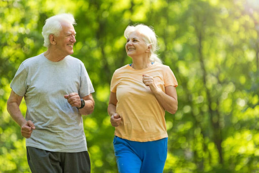 Parmer Woods at North Austin | Happy senior couple jogging outside