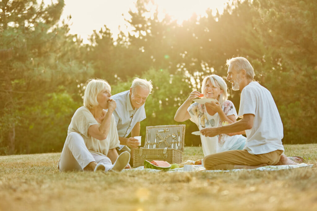 Town Village Crossing | Group of seniors picnicking