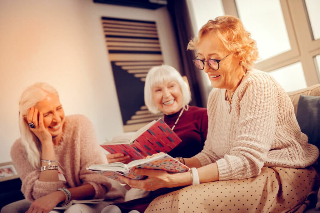 Whispering Winds of Apple Valley | Happy seniors reading together