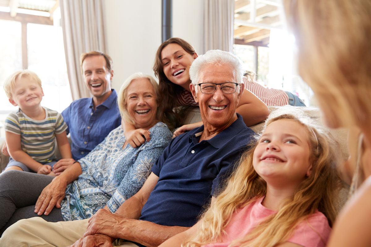 Pegasus Senior Living | Happy senior man surrounded by family
