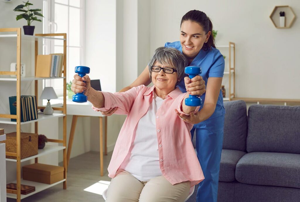Belleview Suites at DTC | Senior woman doing arm exercises with caregiver