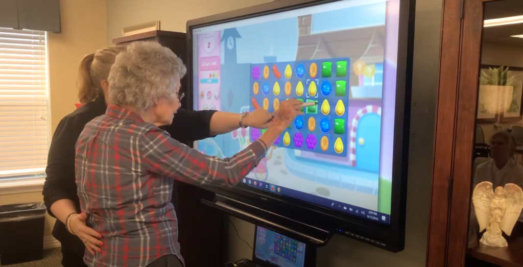 Bridgewood Gardens | Resident playing Candy Crush with SmartBoard