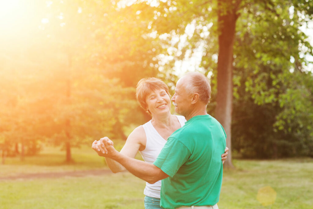 Bridgewood Gardens | Senior couple dancing during sunset