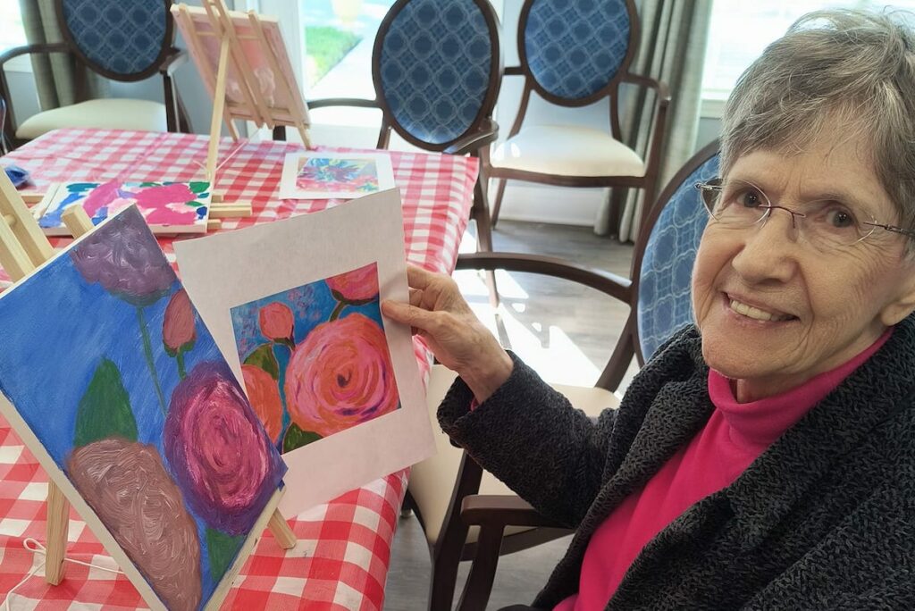 Bridgewood Gardens | Senior showing off her paintings