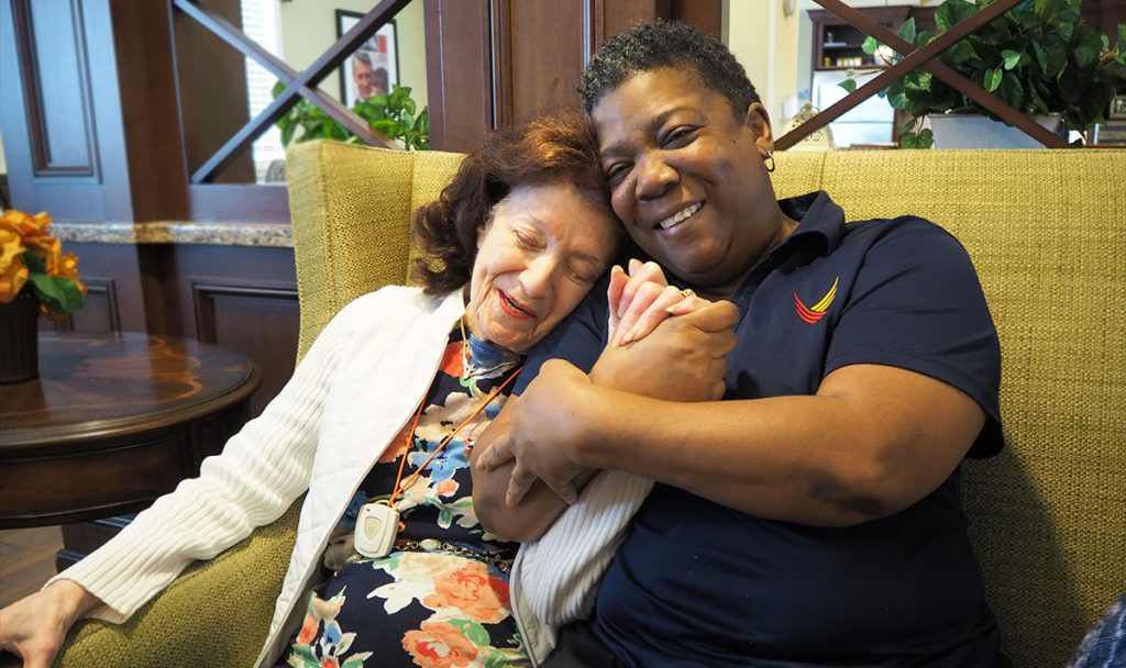 Pegasus Senior Living | Director embracing senior living resident