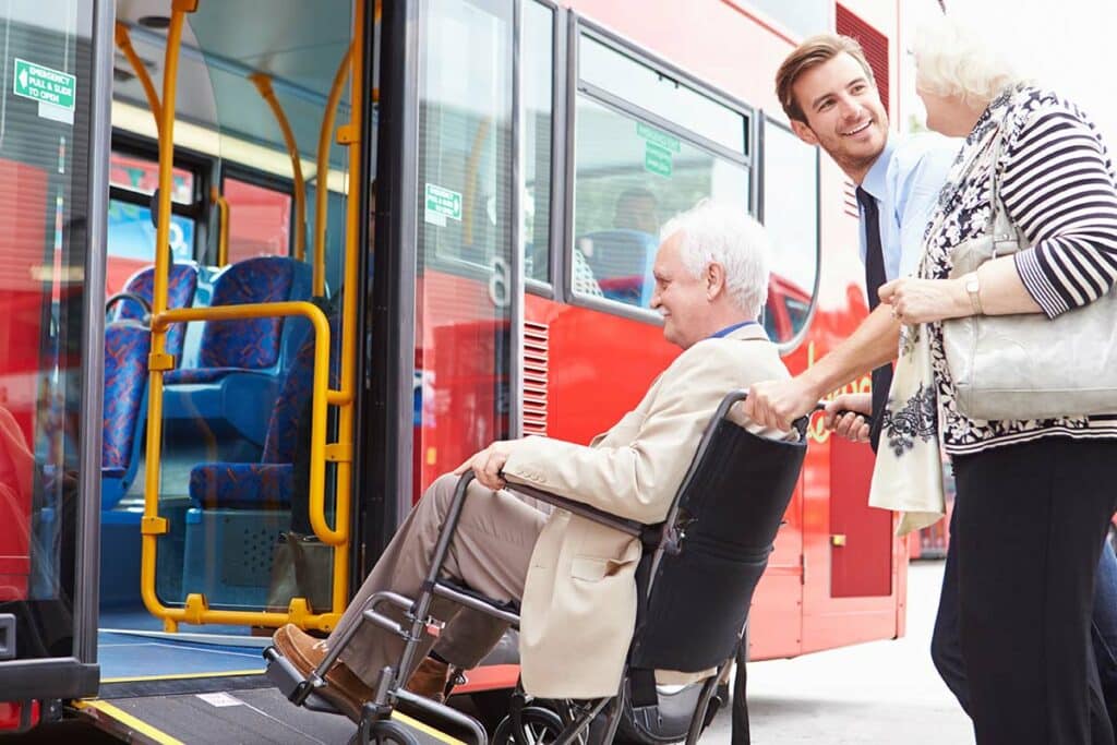 Broadway Mesa Village | Senior man in wheelchair receiving transportation assistance