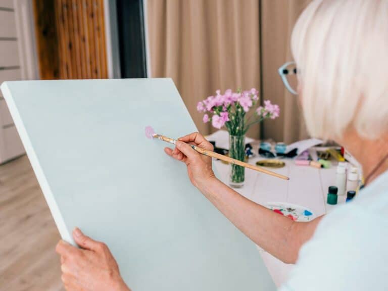Broadway Mesa Village | Senior woman painting canvas