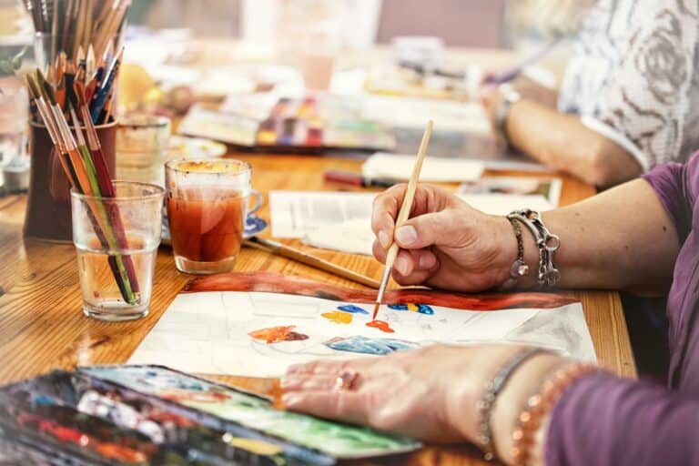 Broadway Mesa Village | Seniors painting at table