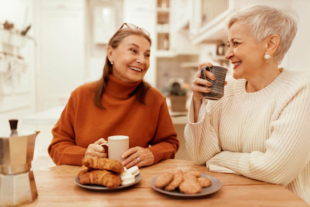 Broadway Mesa Village | Senior women talking over breakfast