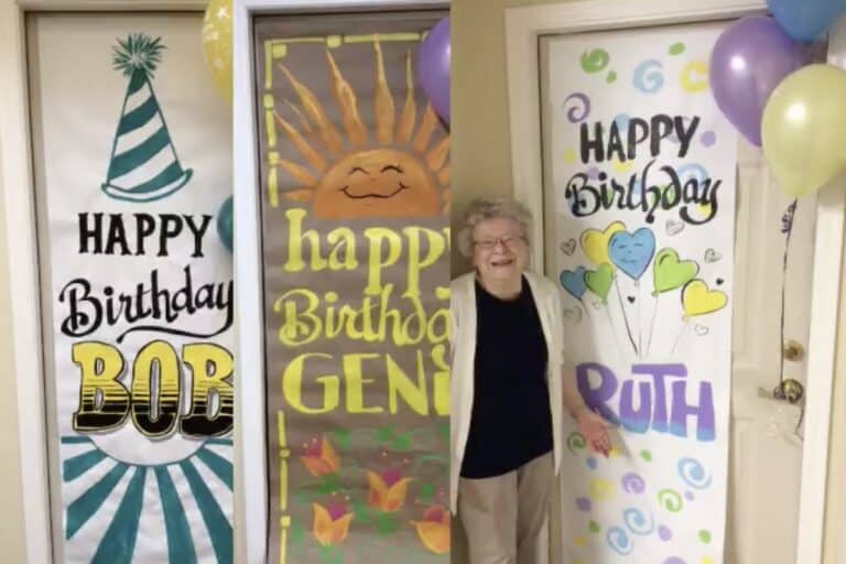 Broadway Mesa Village | Senior standing in front of her hand painted birthday drawing
