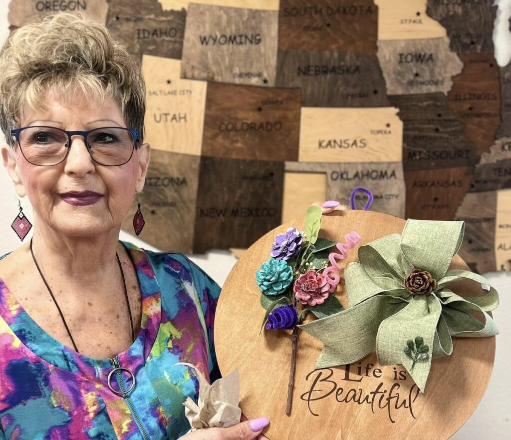 Broadway Mesa Village | Senior community resident showing her craft