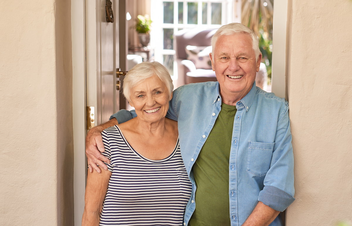 Castlewoods Place | Senior couple smiling in the doorway