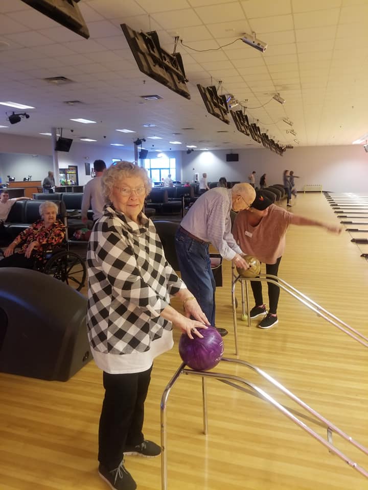 Castlewoods Place | Resident bowling during outing