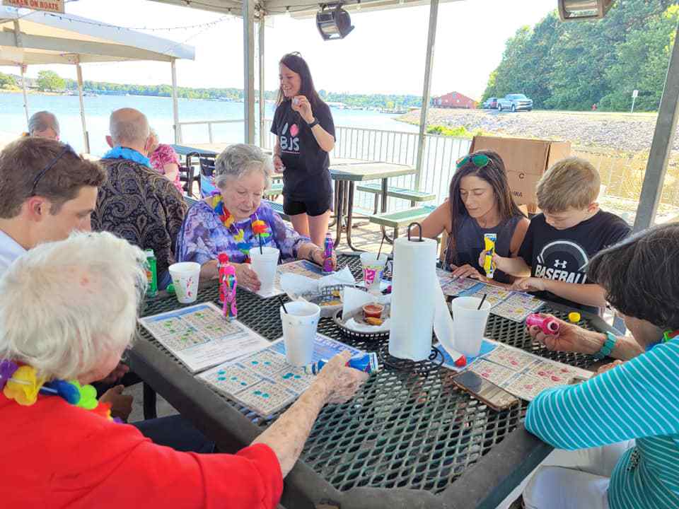 Castlewoods Place | Seniors and their family members playing bingo