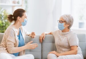 Pegasus Senior Living | Senior mother visiting with daughter during COVID