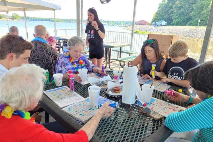 Castlewoods Place | Seniors and their family members playing bingo