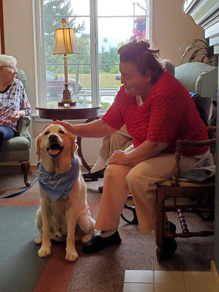 Cordata Court | Senior woman with therapy dog
