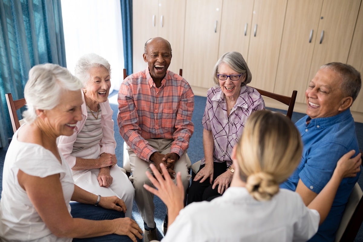 Creston Village | Cheerful seniors sitting as a group