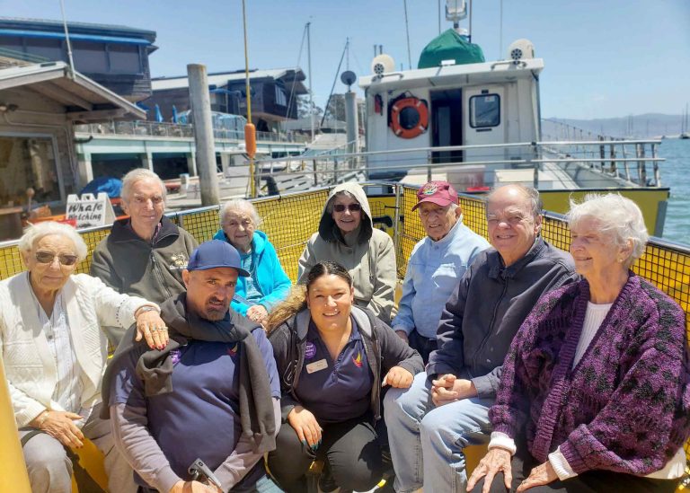 Creston Village | Group on a boat during outing