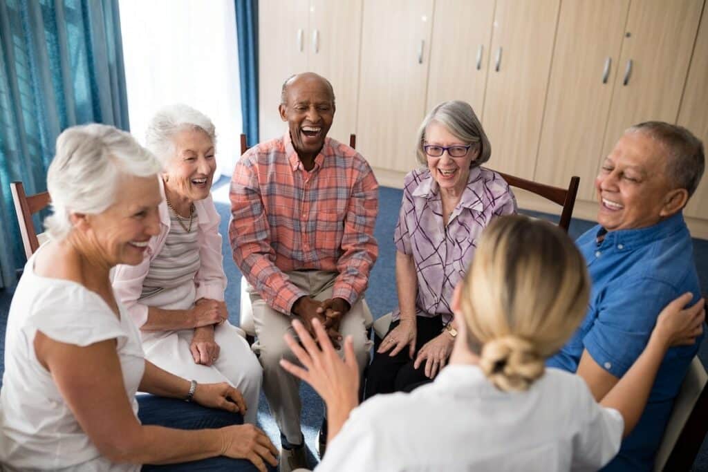 Creston Village | Cheerful seniors sitting as a group