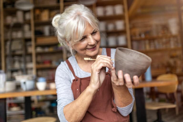 Creston Village | Senior woman making pottery