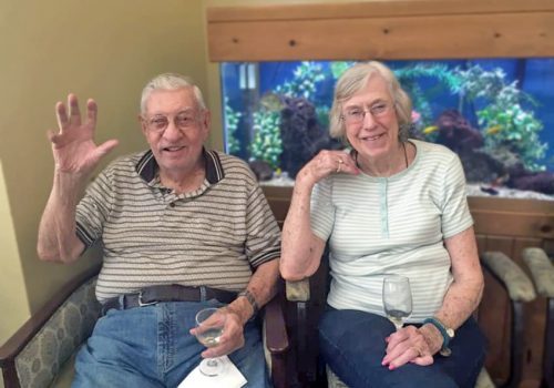 Creston Village | Residents in front of fish tank
