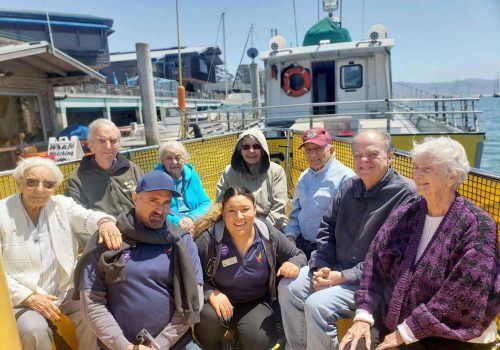 Creston Village | Residents on boat during outing