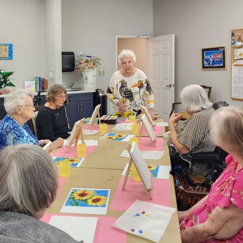 Creston Village | Seniors at painting table