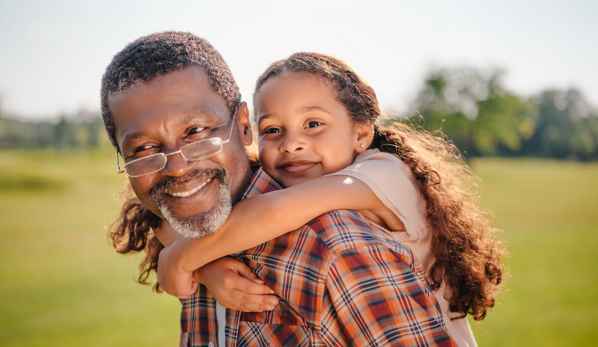 Dunwoody Place | Senior giving granddaughter a piggyback ride