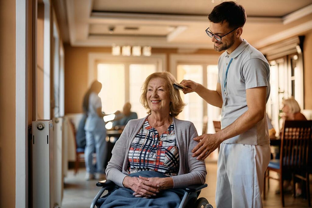 Dunwoody Place | Caregiver assisting senior woman by brushing her hair