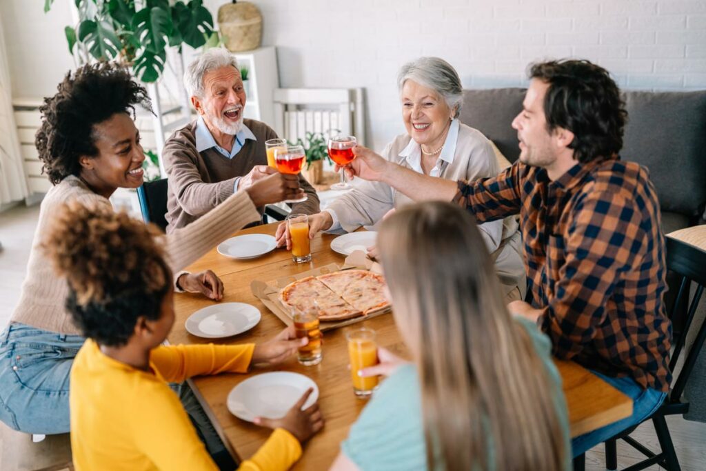 Elk Grove Park | Senior couple eating dinner with family at table