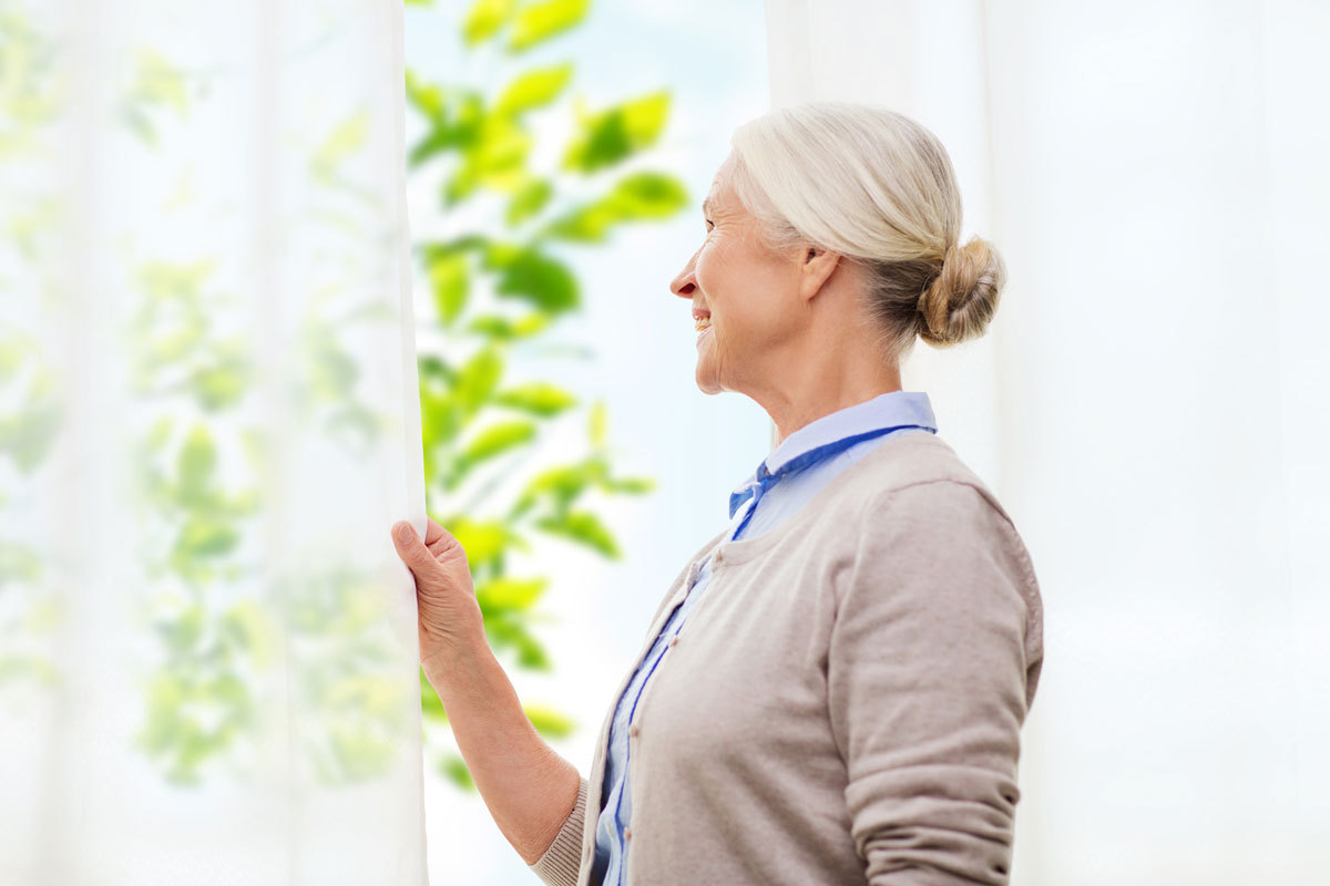 Pegasus Senior Living Elk Grove Sacramento | Senior looking through window