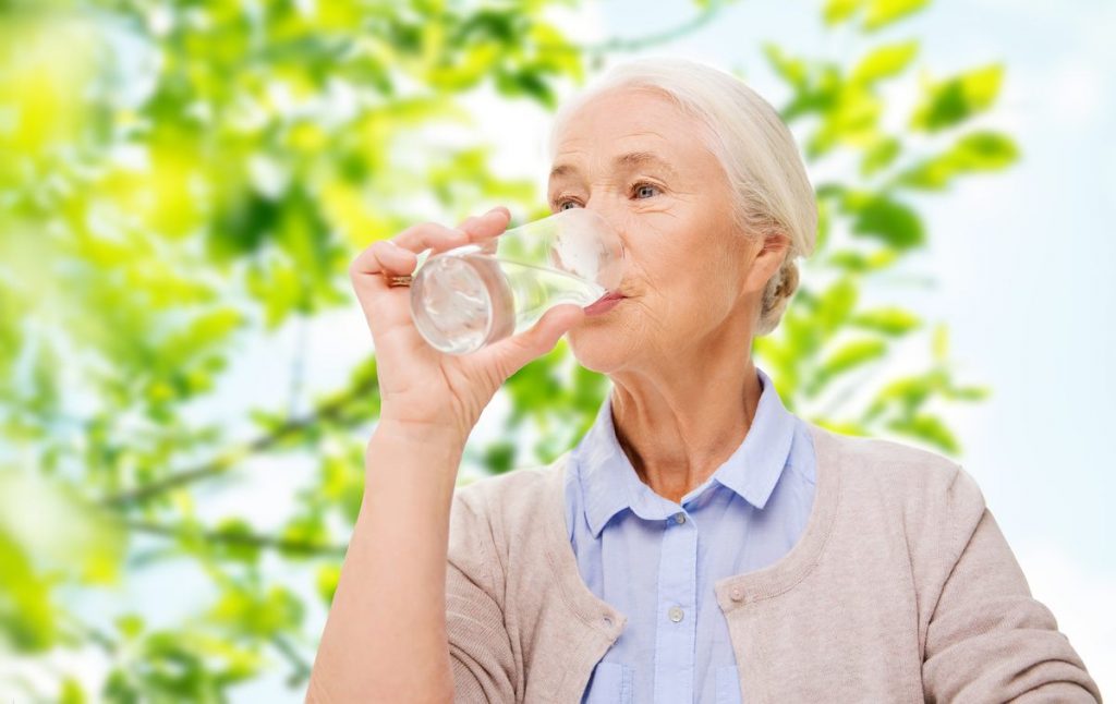 Evergreen Place | Senior woman drinking water