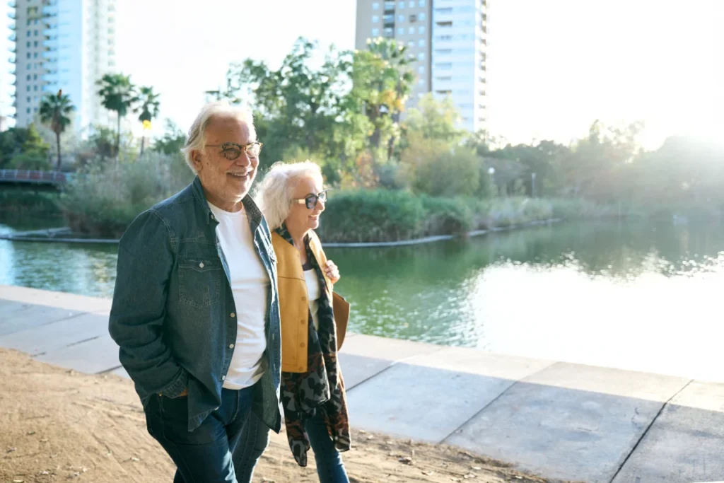 Senior couple walking near canal