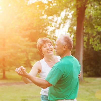 Evergreen Place | Senior couple dancing in sunset