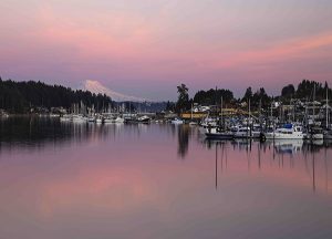 Gig Harbor Court | Local sailboats behind mountains during sunset