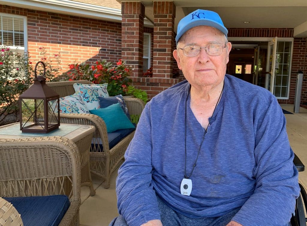 Glenwood Village of Overland Park | Senior man sitting on porch