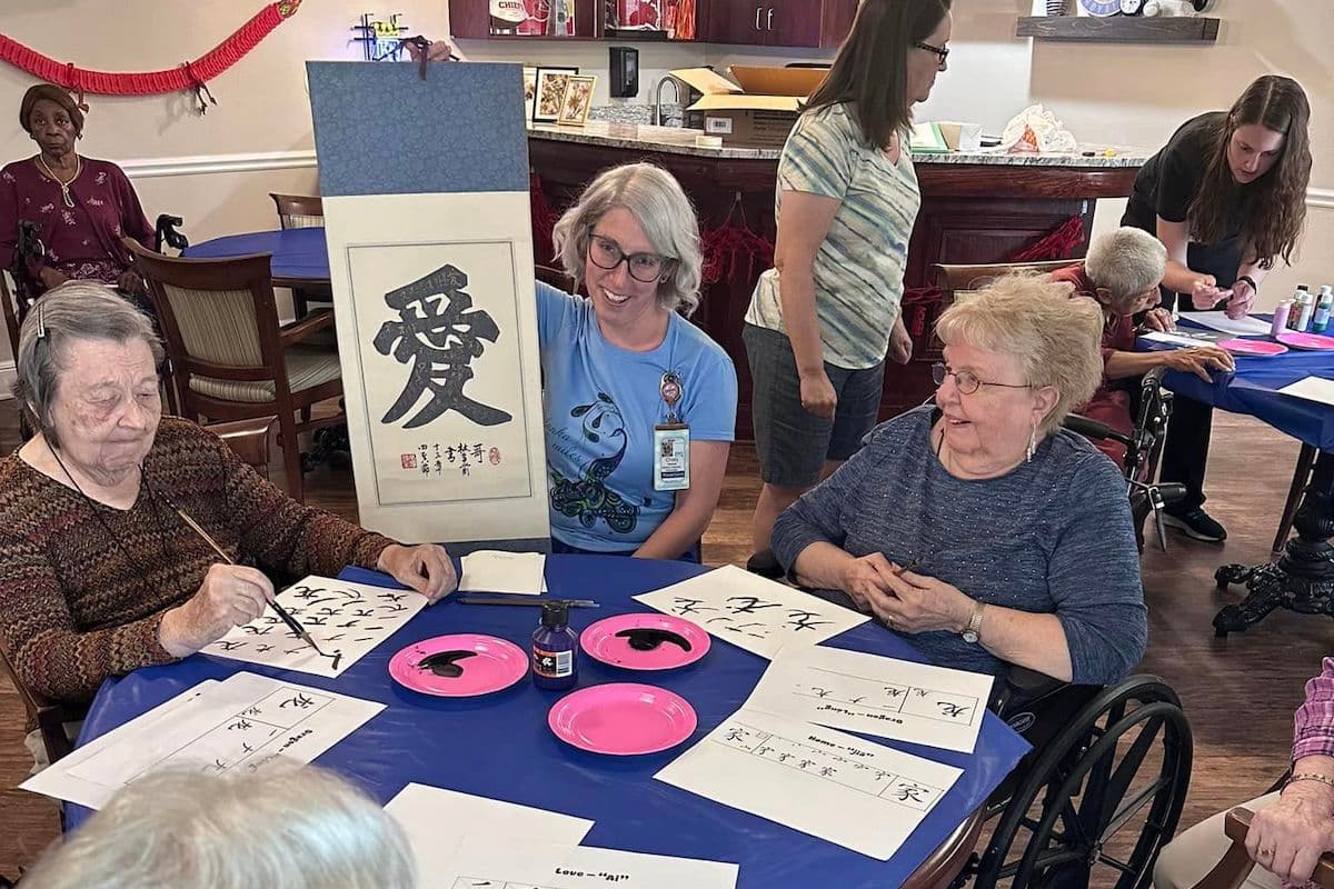 Glenwood Village of Overland Park | Senior community residents learning calligraphy