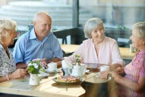 Pegasus Senior Living | Seniors drinking coffee and smiling together