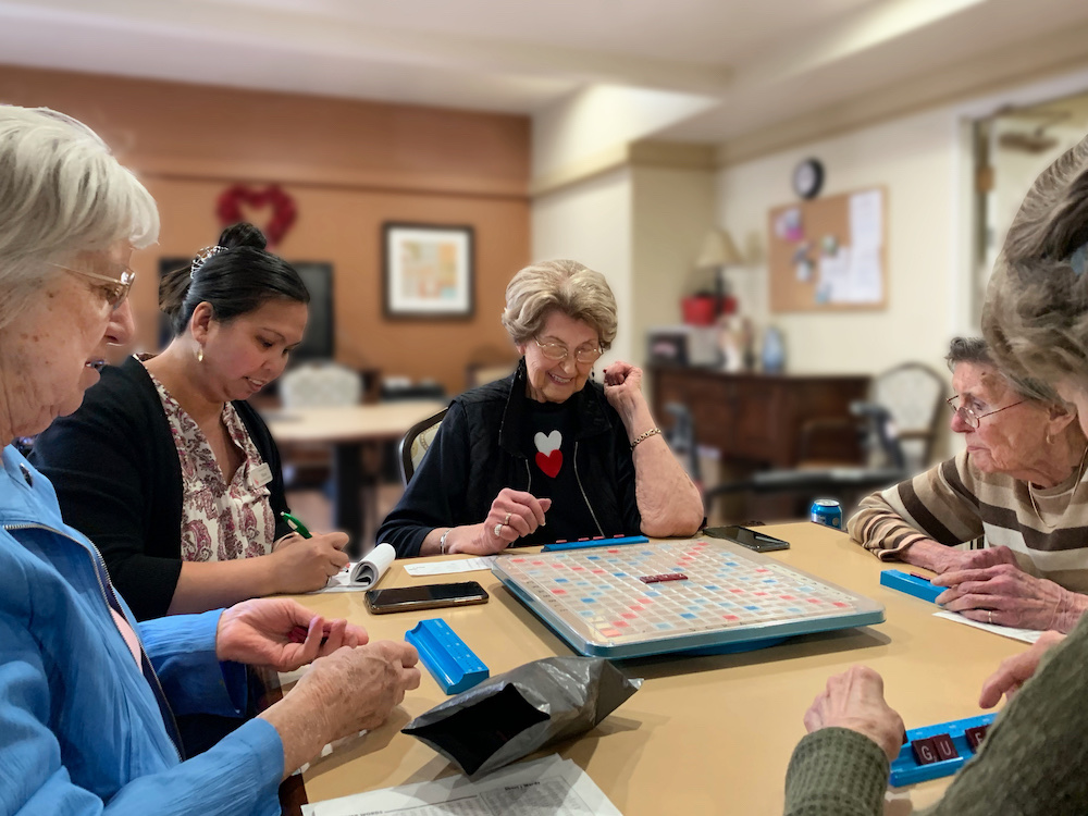 Greenhaven Place | Seniors playing Scrabble