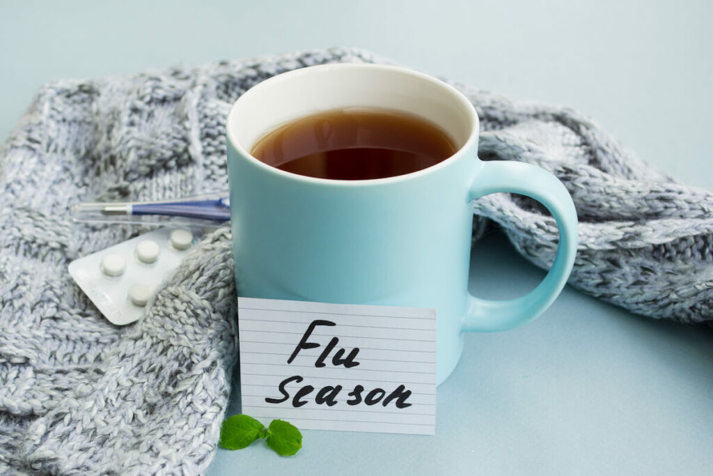Pegasus Senior Living | Mug of tea next to a card that reads flu season