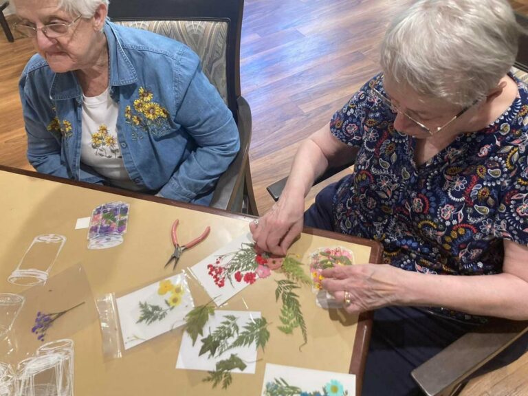 Greenhaven Place | Senior women crafting at table