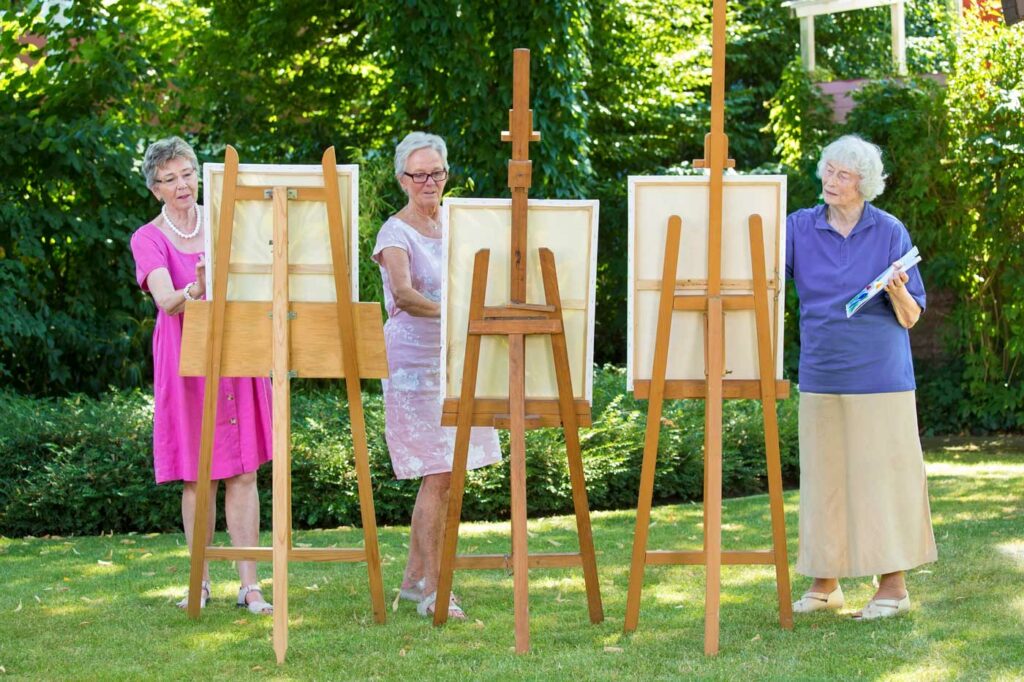 Greenhaven Place | Senior women painting canvases