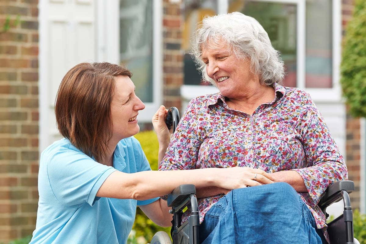 Historic Place of Roswell | Carer With Senior Woman In Wheelchair