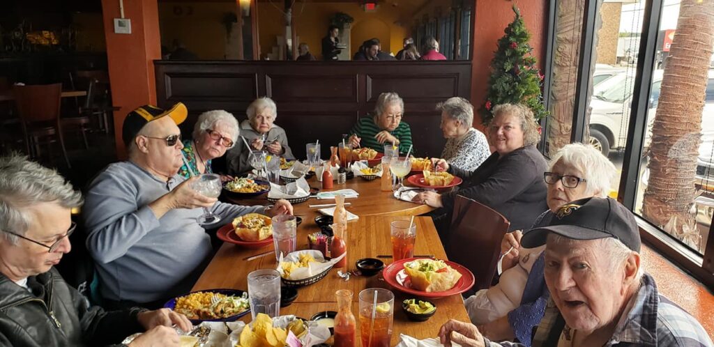 Laketown Village | Seniors dining during outing