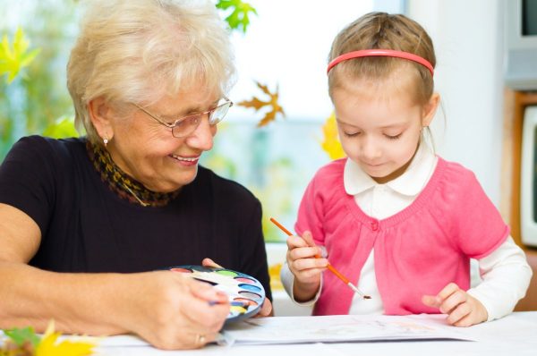 Laketown Village | Senior woman drawing with young girl Laketown Village | Senior woman drawing with young girl