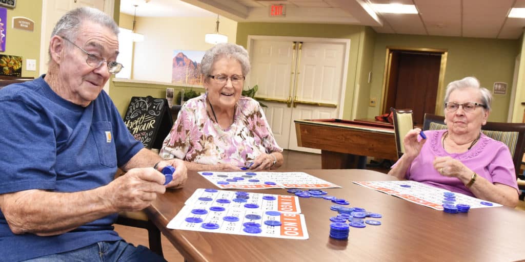 Pegasus Senior Living | Group of seniors playing Bingo
