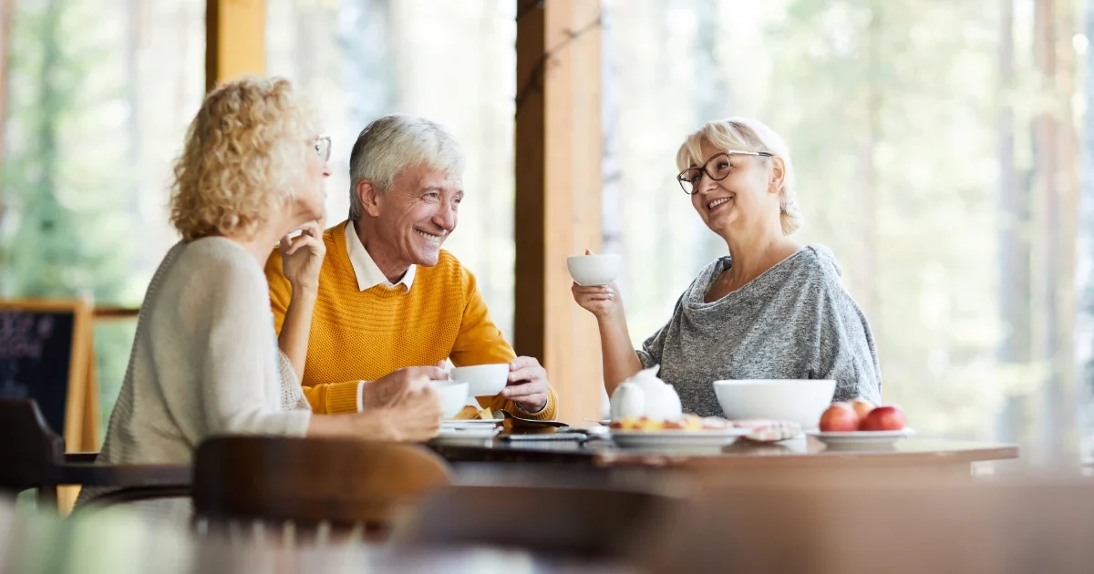 seniors-drinking-coffee-on-porch.webp