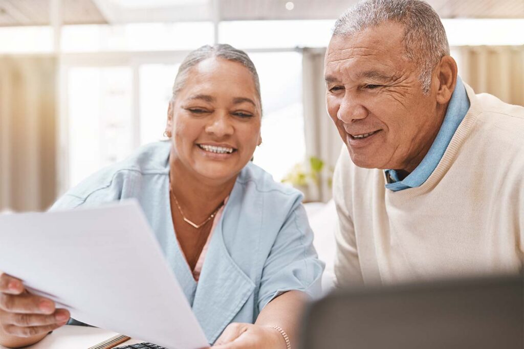 North Point Village | Senior man, woman having a conversation about insurance, retirement or finance goals | Washington memory care