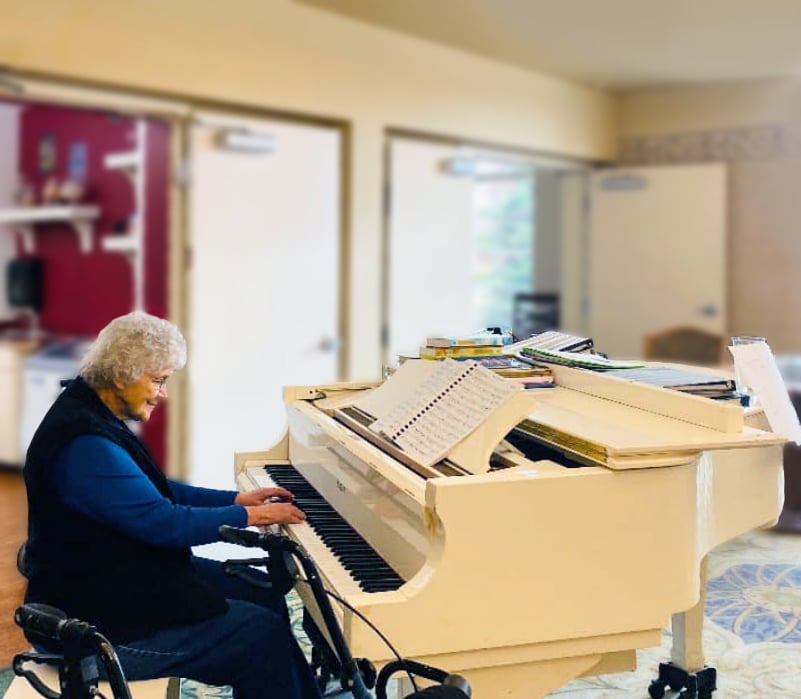 North Point Village | Senior woman playing piano